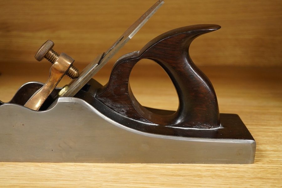 A Spiers dovetailed 14 1/2” panel plane, stamped with Spiers, Ayr to the brass lever cap and fitted with a Sorby iron, with rosewood infill
